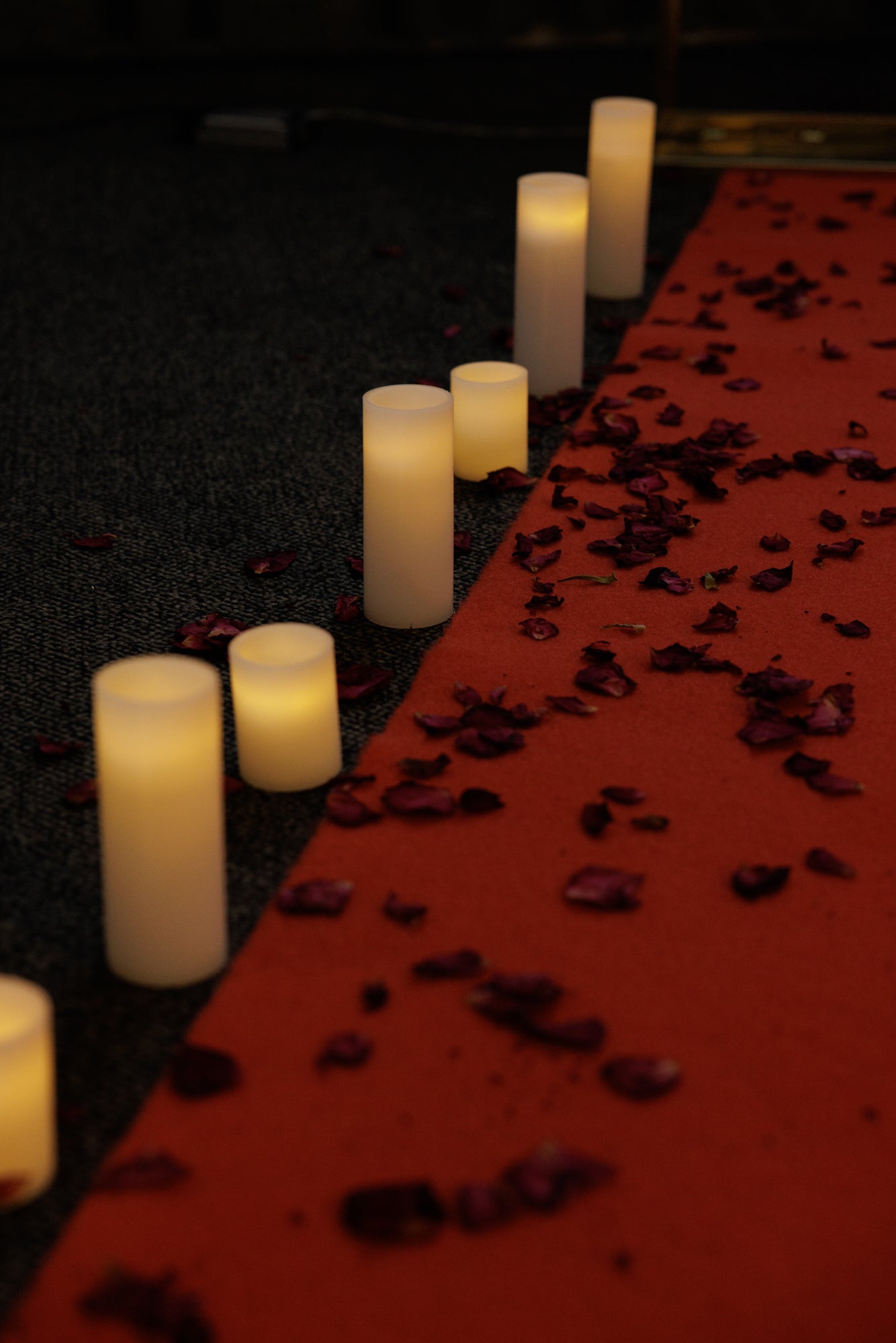 Red carpet hire Melbourne with candles and rose petals for romantic event
