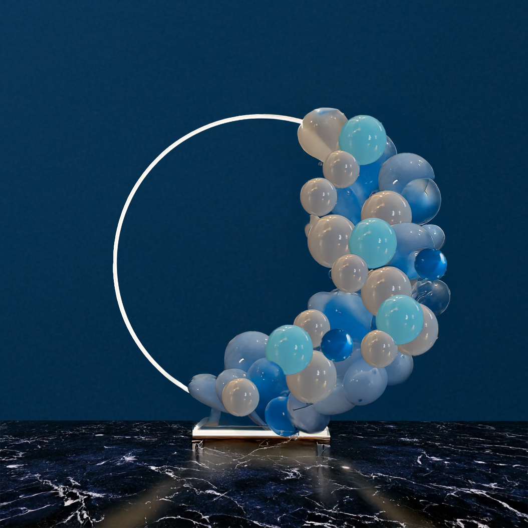 A 2-metre tall white balloon frame with a circular shape decorated in blue and white balloons. The frame appears to be standing on a marble-like surface.