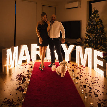 Red carpet hire Melbourne with marry me lights for romantic indoor proposal